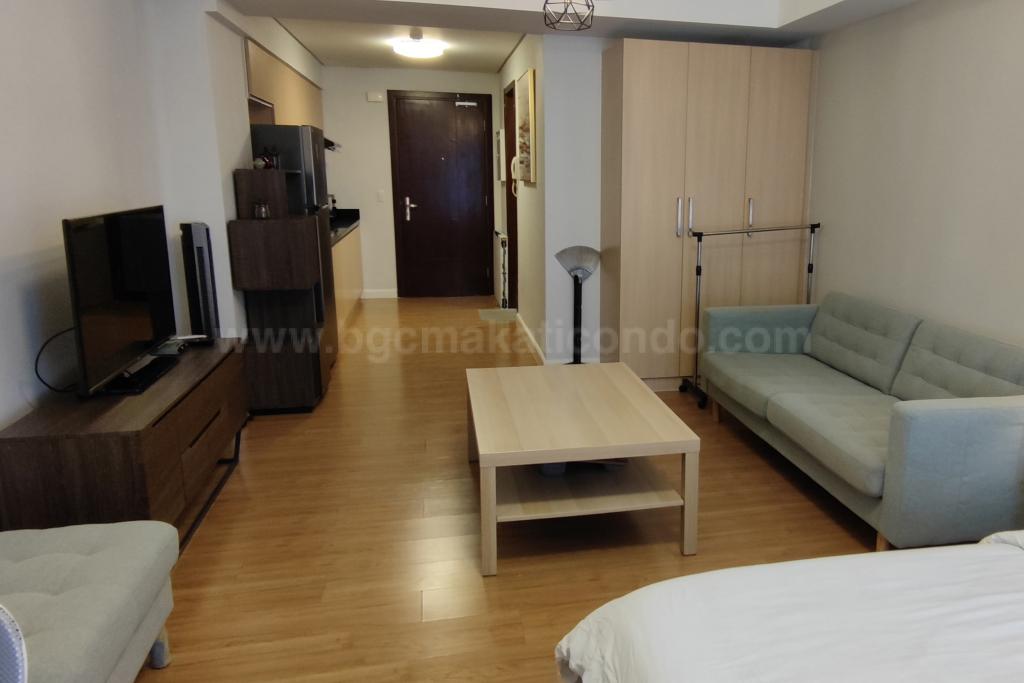 Living area of studio condo unit at Verve Residences