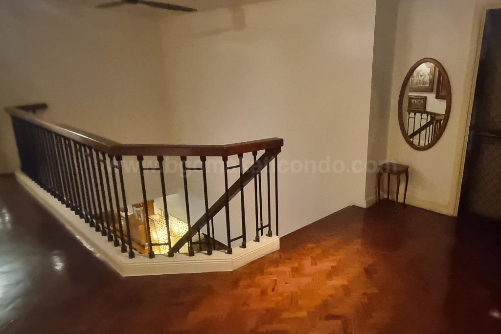 Stairs of 3-bedroom bi-level condo unit at The Regency at Salcedo