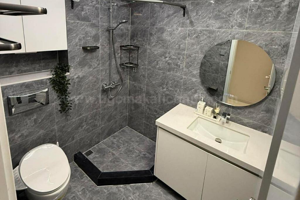 Toilet and bath of 2-bedroom condo unit at The Trion Towers tower 2