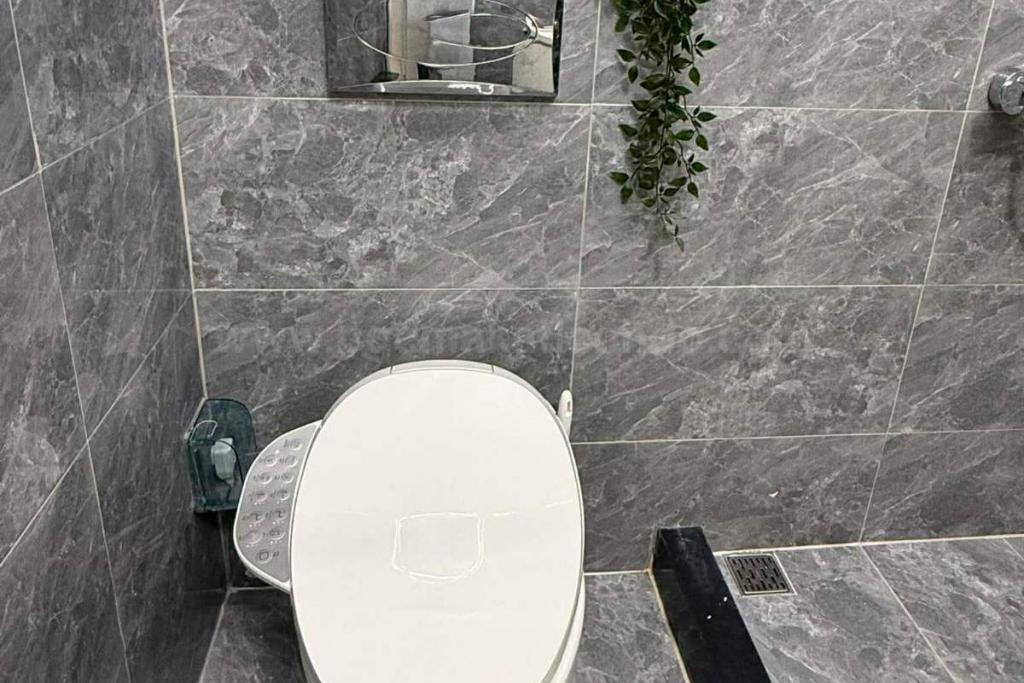 Toilet and bath of 2-bedroom condo unit at The Trion Towers tower 2