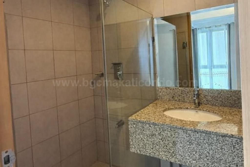 Toilet and bath of 1-bedroom condo unit at Times Square West