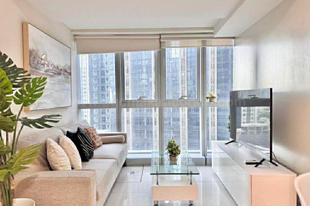 Living area of executive 2-bedroom condo unit at Uptown Parksuites tower 1