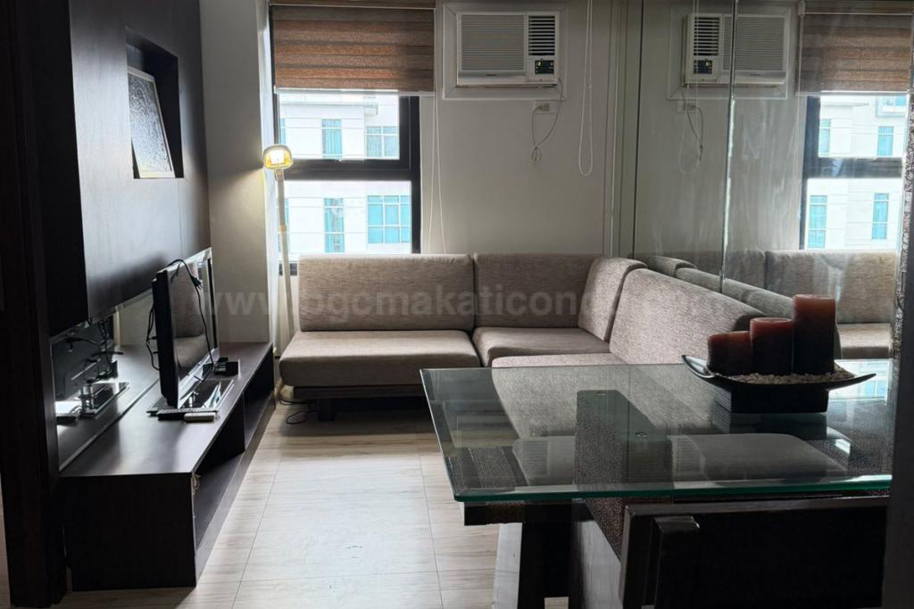 Dining and living areas of 2-bedroom loft unit at The Fort Residences