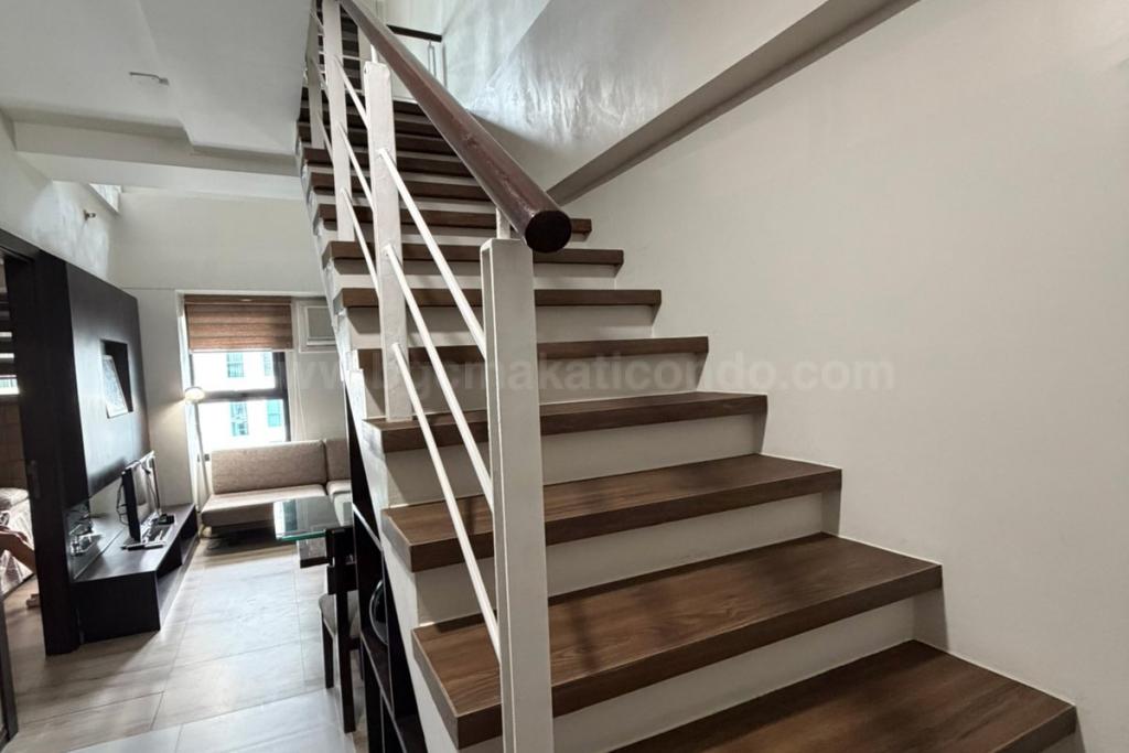 Stairs of 2-bedroom loft unit at The Fort Residences