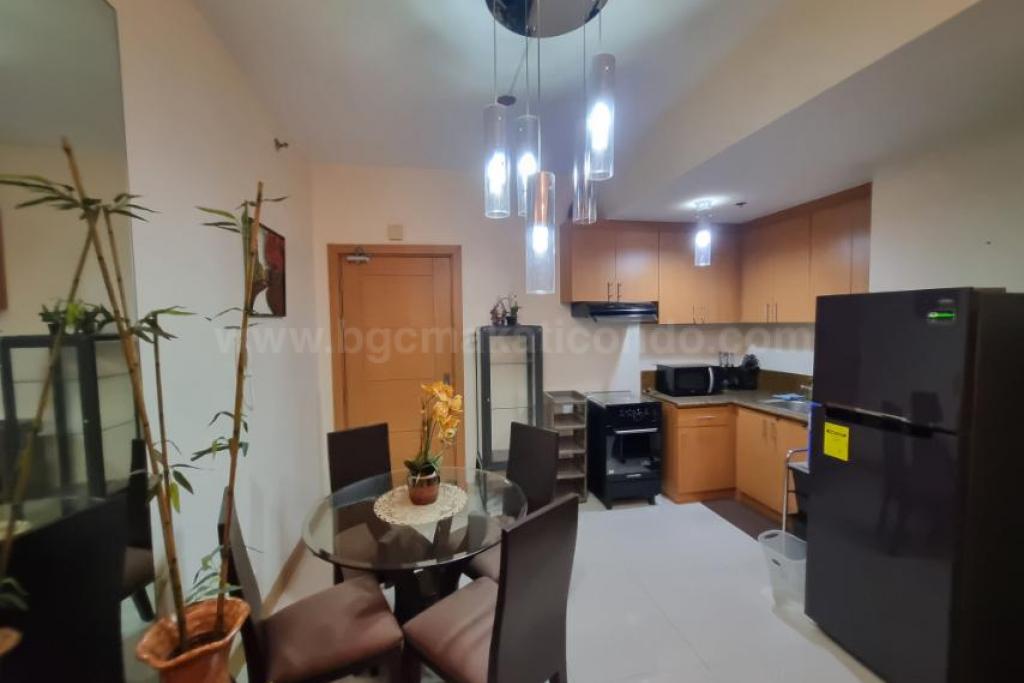 Dining and kitchen areas of 1-bedroom condo unit at The Trion Towers tower 1