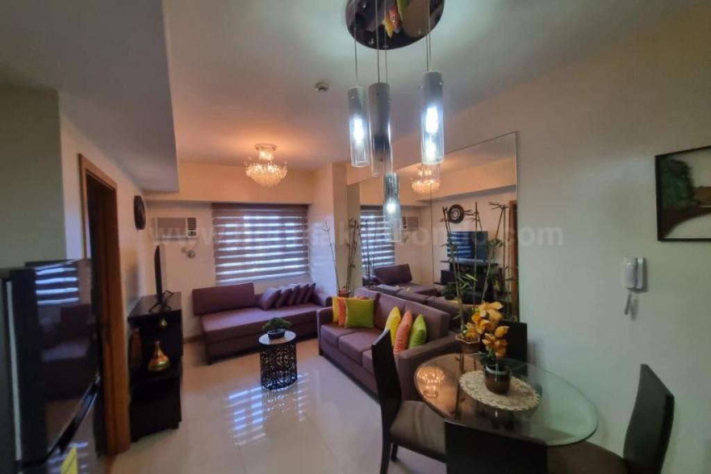 Dining and living areas of 1-bedroom condo unit at The Trion Towers tower 1