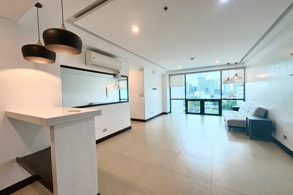 Dining and living areas of 2-bedroom condo unit at Bonifacio Ridge