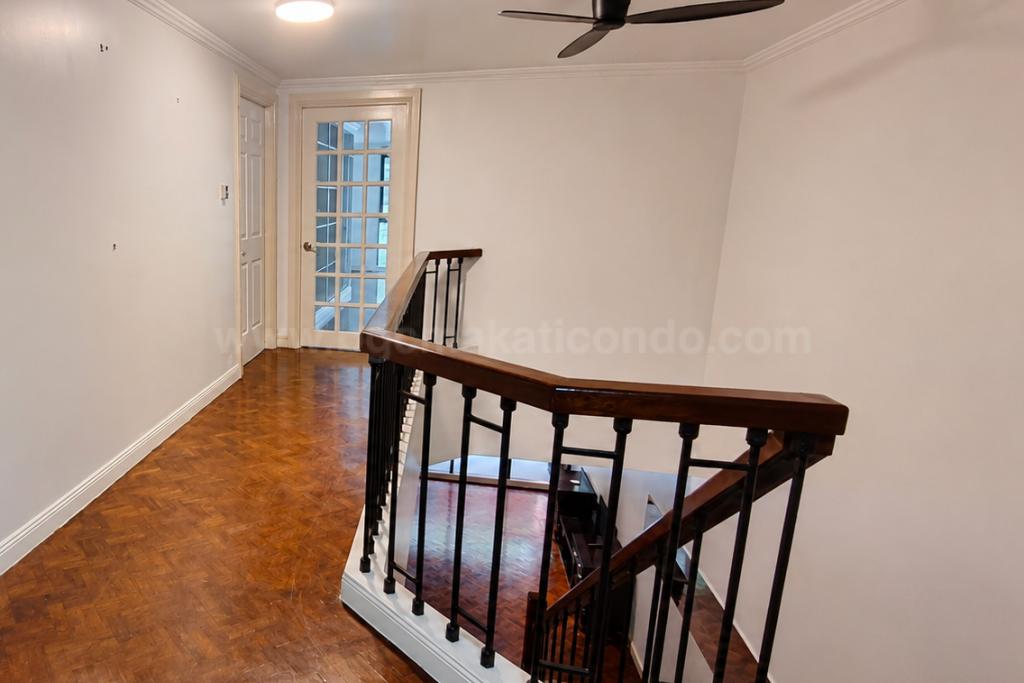 Stairs of 3-bedroom bi-level condo unit at The Regency at Salcedo