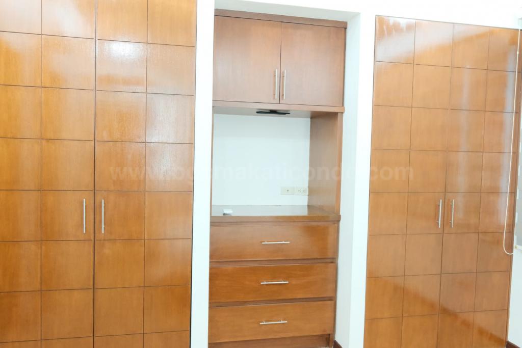 Master built-in closet of 2-bedroom condo unit at Bonifacio Ridge