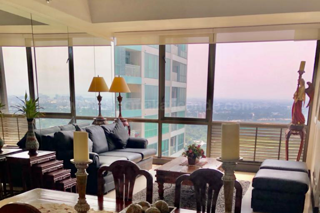 Living area blinds rolled up of three bedroom condominium unit at Bellagio tower 3
