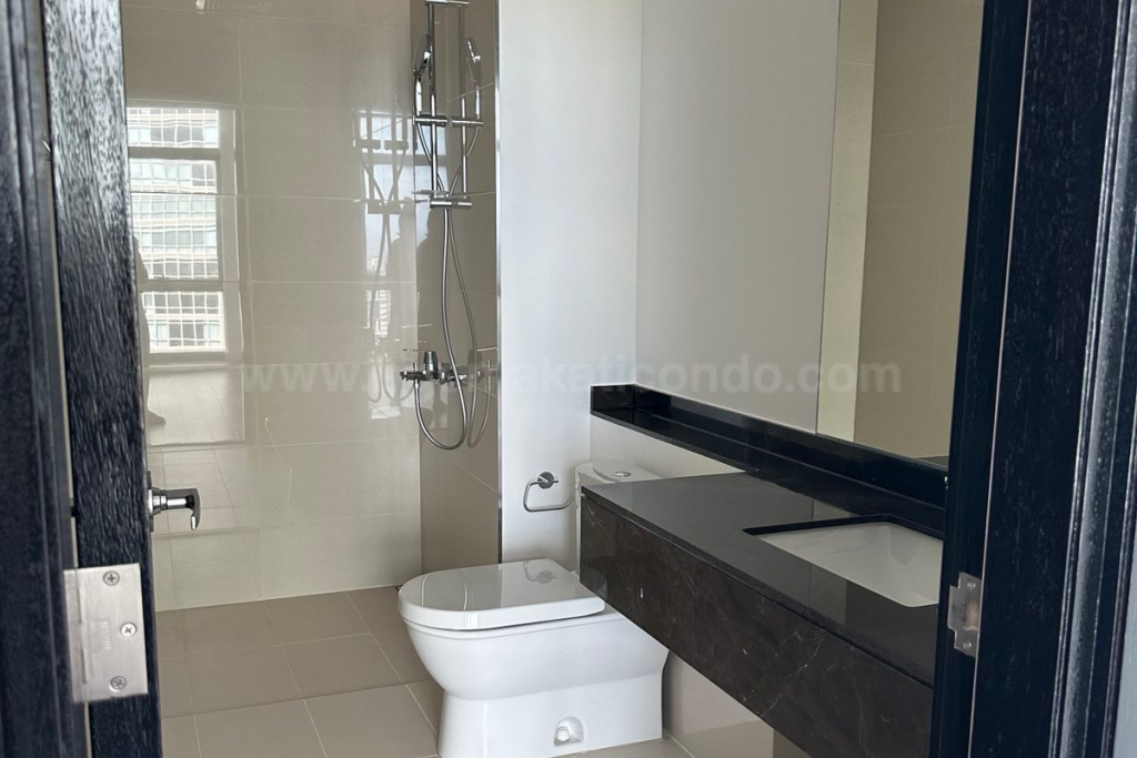 Toilet and bath of 2-bedroom condo unit at West Gallery Place