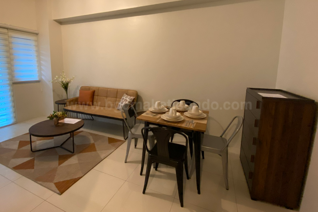 Dining and living areas front view of 1-bedroom condo unit at Central Park West