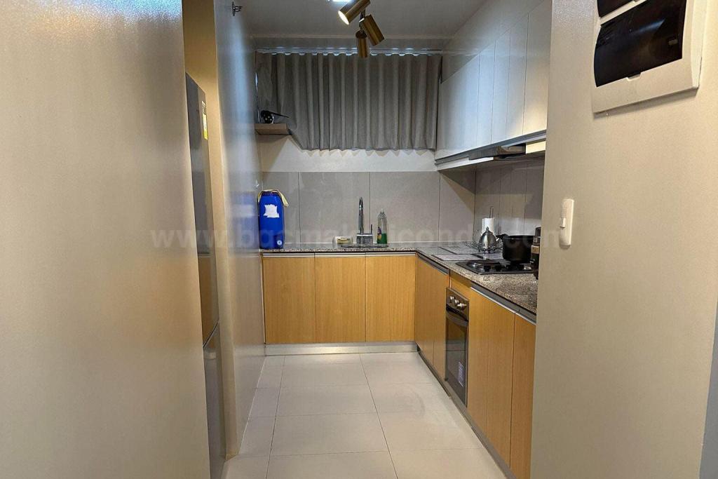 Kitchen area of 2-bedroom condo unit at Uptown Ritz