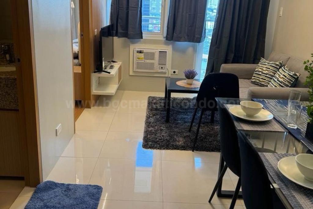 Living and dining areas of 1-bedroom condo unit at Times Square West