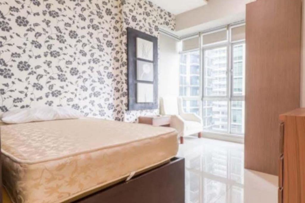 Bedroom 2 of 2-bedroom condo unit at Sapphire Residences