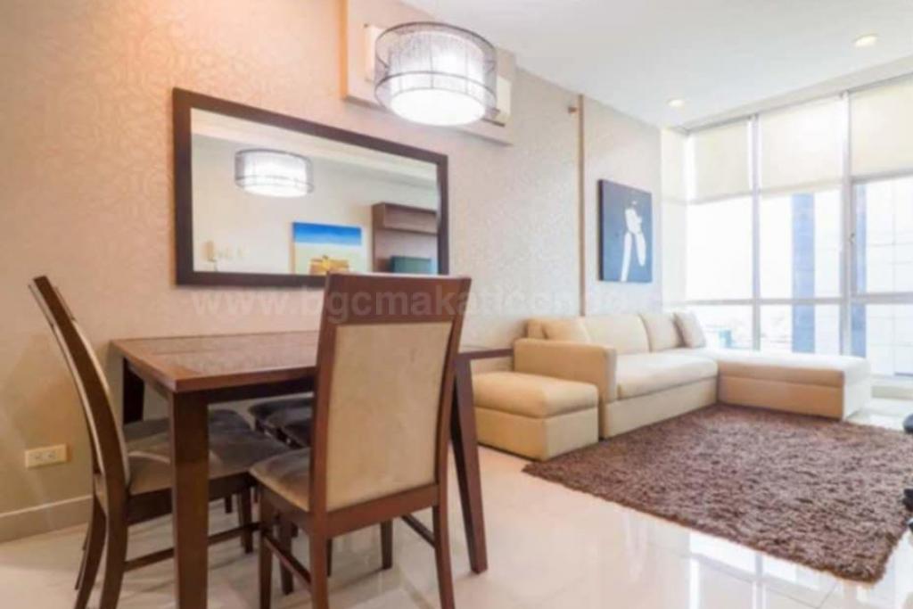 Dining and living areas of 2-bedroom condo unit at Sapphire Residences