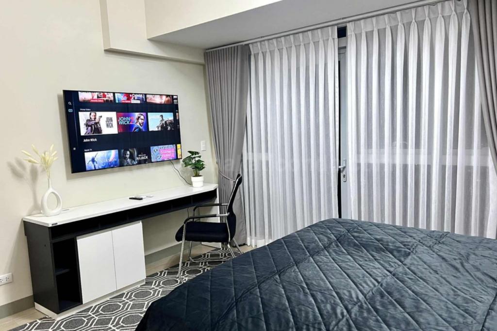 Master's bedroom television of 2-bedroom condo unit at Uptown Parksuites tower 2