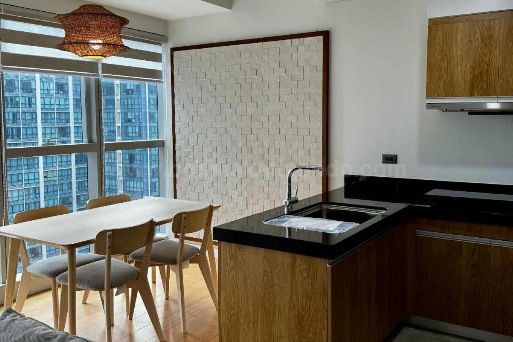 Dining and kitchen areas of 2-bedroom condo unit at The Seasons Residences