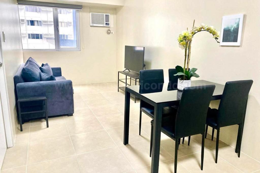 Dining and living areas of 1-bedroom condo unit at Avida Towers Turf tower 2