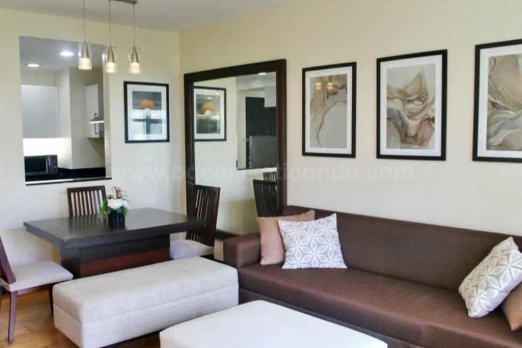 Living and dining areas of 1-bedroom condo unit at One Serendra