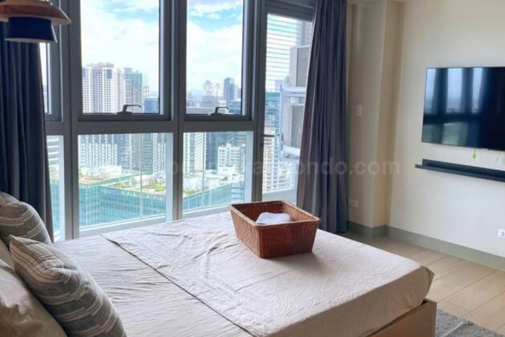 Bedroom of 1-bedroom condo unit at Uptown Parksuites