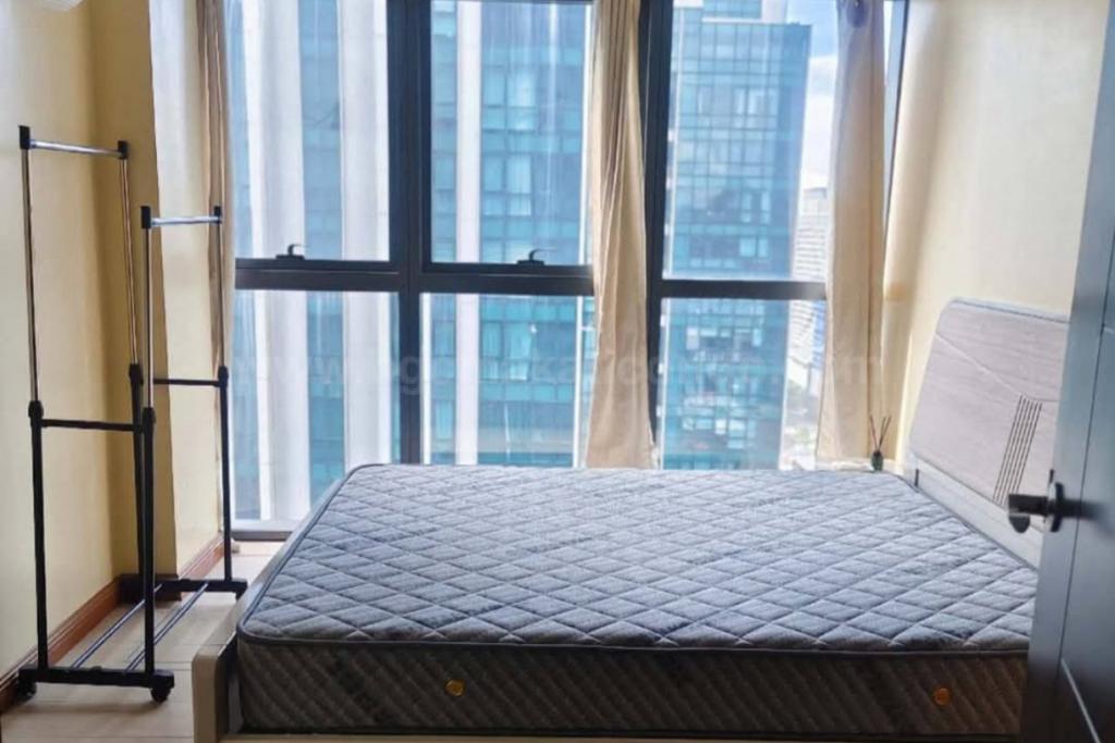 Bedroom 2 of 2-bedroom condo unit at Uptown Ritz Residences