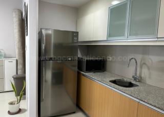 Kitchen area of 2-bedroom condo unit at Uptown Ritz Residence