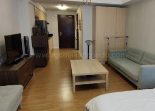 Living area of studio condo unit at Verve Residences