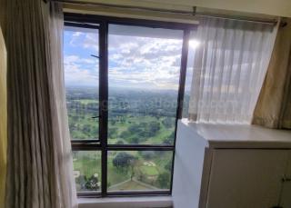 Floor-to-ceiling windows of living area of 2-bedroom condominium unit at Bellagio Tower 3