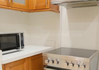 Kitchen area of 2-bedroom condo unit at Bonifacio Ridge