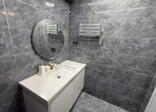 Toilet and bath of 2-bedroom condo unit at The Trion Towers tower 2