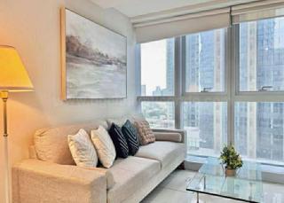 Living area of executive 2-bedroom condo unit at Uptown Parksuites tower 1