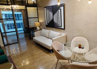 Dining and living areas of 1-bedroom condo unit at One Maridien