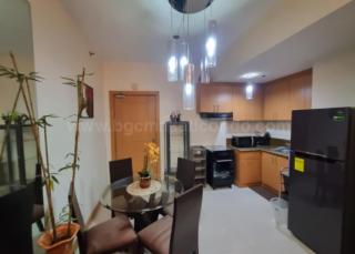 Dining and kitchen areas of 1-bedroom condo unit at The Trion Towers tower 1