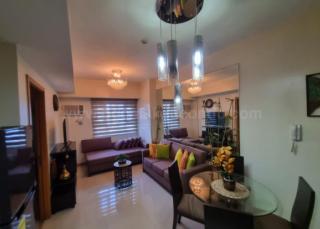Dining and living areas of 1-bedroom condo unit at The Trion Towers tower 1