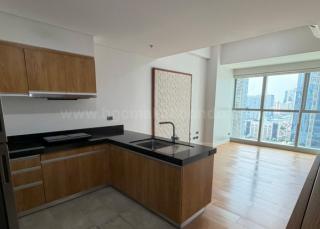 Kitchen and living areas of 1-bedroom condominium unit at The Seasons Residences