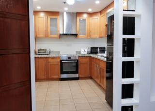 Kitchen area of 2-bedroom condo unit at Bonifacio Ridge