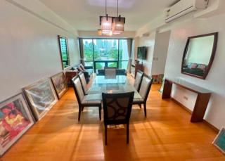 Dining and living areas of 2-bedroom condo unit at Bonifacio Ridge