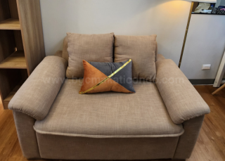 Couch of executive 1 bedroom unit at Uptown Parksuites tower 2