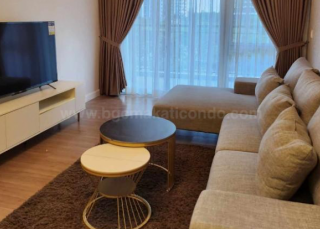 Living area showing television of 2-bedroom unit at Verve Residences