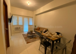 Dining and living areas of 1-bedroom condo unit at Central Park West Dining and living areas of 1-bedroom condo unit at Central Park West