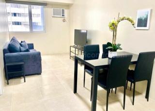 Dining and living areas of 1-bedroom condo unit at Avida Towers Turf tower 2
