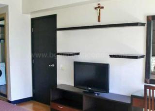 Bedroom television of 1-bedroom condo unit at One Serendra