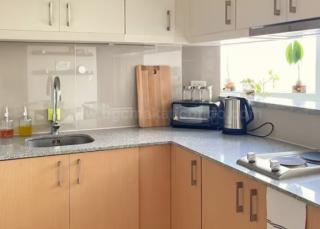 Kitchen area of 1-bedroom condo unit at Uptown Parksuites
