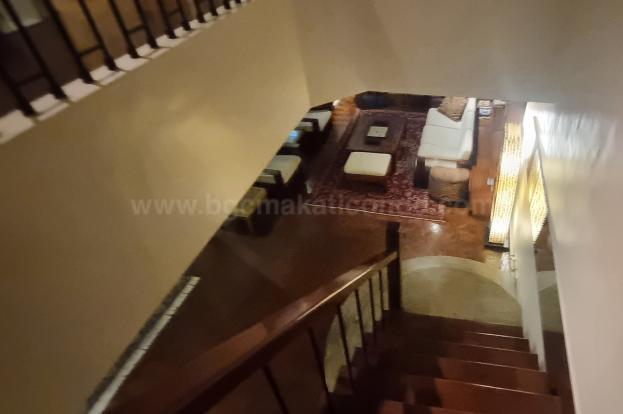 Stairs of 3-bedroom bi-level condo unit at The Regency at Salcedo