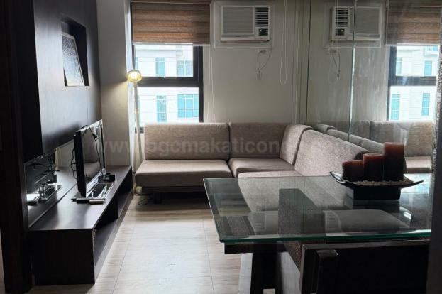 Dining and living areas of 2-bedroom loft unit at The Fort Residences