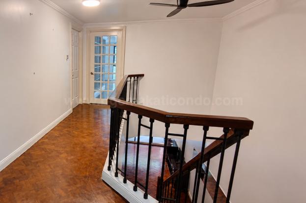 Stairs of 3-bedroom bi-level condo unit at The Regency at Salcedo