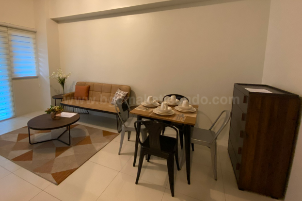 Dining and living areas front view of 1-bedroom condo unit at Central Park West