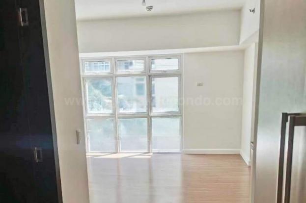 Living sleeping area of studio condominium unit at The Veranda