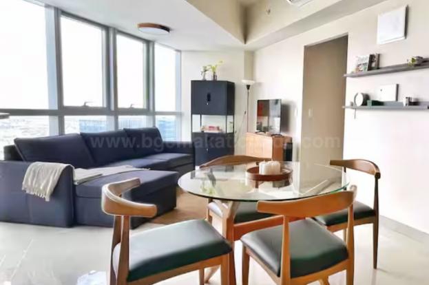 Dining and living areas of 1-bedroom condo unit at Uptown Parksuites